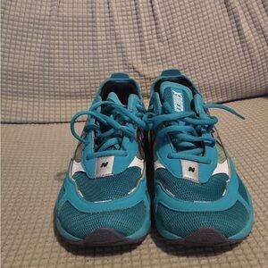 New Balance women’s Turquoise and White Sneakers